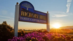 sun rising click Board showing name of Hickory Hill Family Camping Resort New York