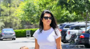 Kourtney Kardashian Reality TV Star-Businesswoman and Influencer elegant look with the white top