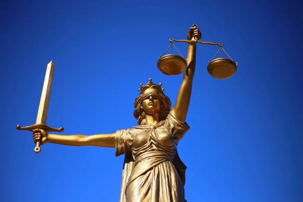 image of Lady of justice with blue background