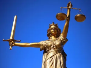 image of Lady of justice with blue background