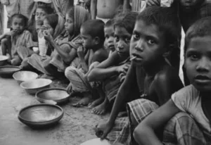 End hunger by 2030 image showing hungry kids waiting for food