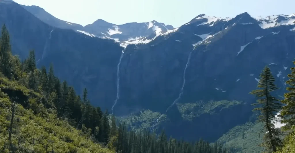 View of Green Mountains with waterfalls at Glacier National Park