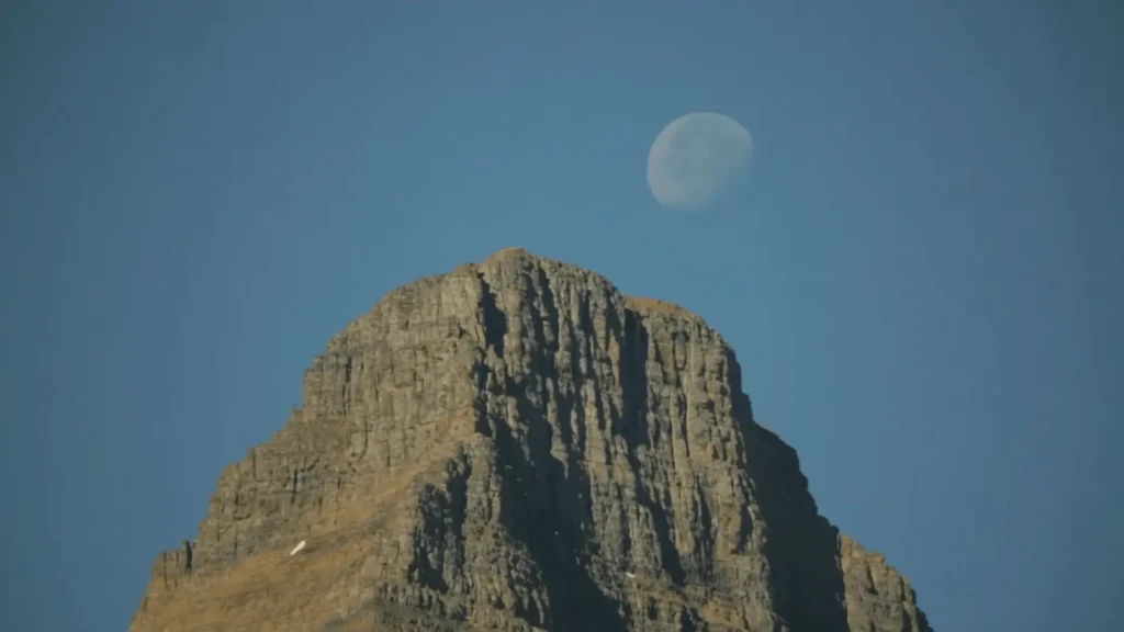 view of moon at top of Rock at Glacier National Park