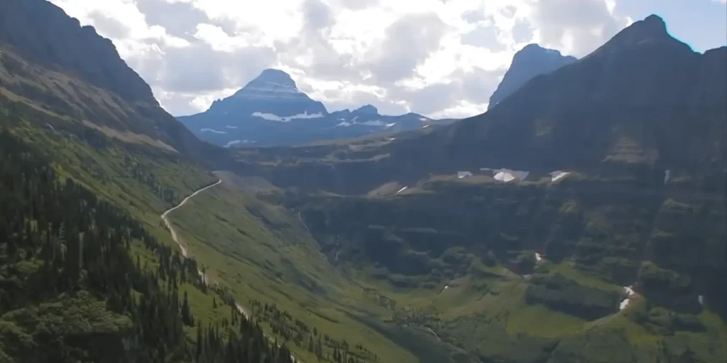 View of Highline Trail with green mountains at Glacier National Park