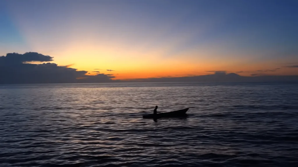 Maratua Island: Your Ultimate Guide to Paradise Diving, Resorts, Turtles 16 Sun Set and boat in sea view at Maratua Island