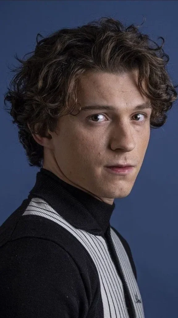 Best Tom Holland Haircut Styles:A Step-by-Step Guide 6 image of Curly Top with Tapered Sides Tom Holland
