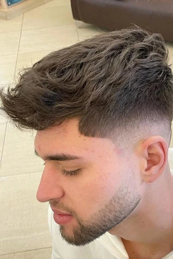 High Taper Fade Haircuts for Men: Styles & Inspiration 3 High Taper Fade with Textured Top, High Taper Haircut