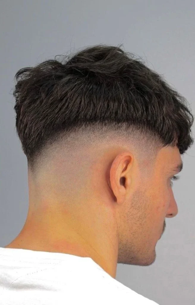 Undercut Low Fade Haircut: A Comprehensive Guide for Men 6 image of Mid fade undercut, low fade haircut