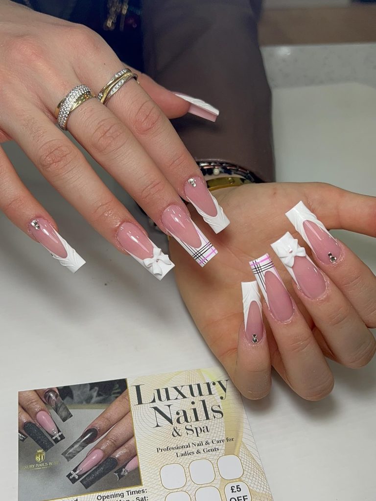 Medium coffin nails entirely in matte blush pink with 3D flowers, leaves, and base all matching in tone