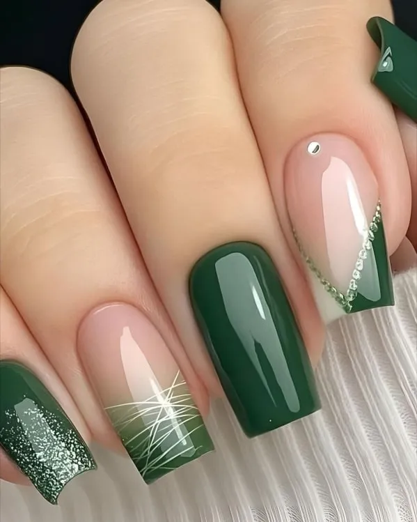 Green Nail Designs: 2026 Sage & Emerald Trends 3 Emerald green glitter nails Elphaba inspired, rich jewel toned green with holographic shimmer, Wicked Broadway witch aesthetic manicure